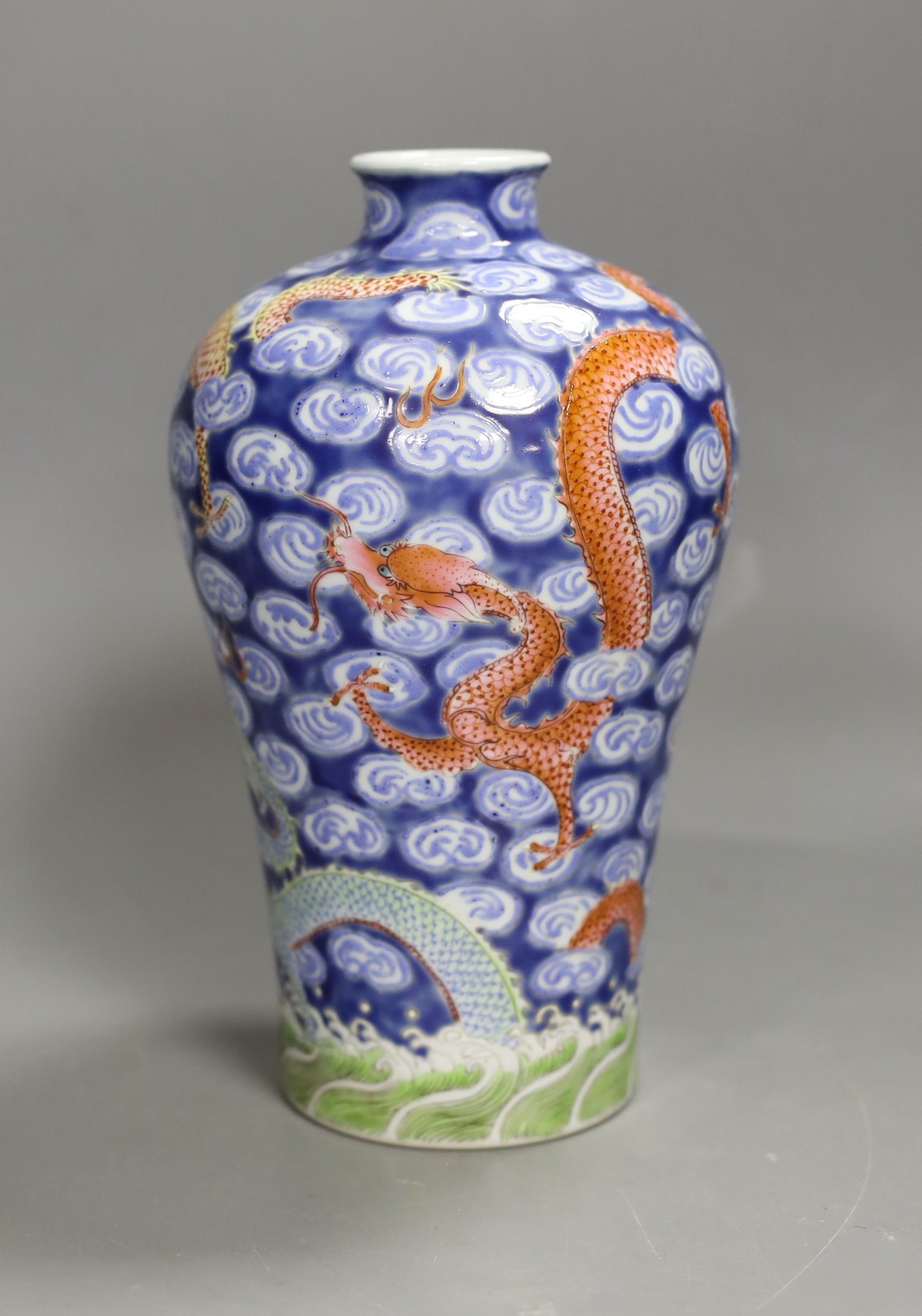 A Chinese famille verte dragon and cloud-fret vase. 20cm high